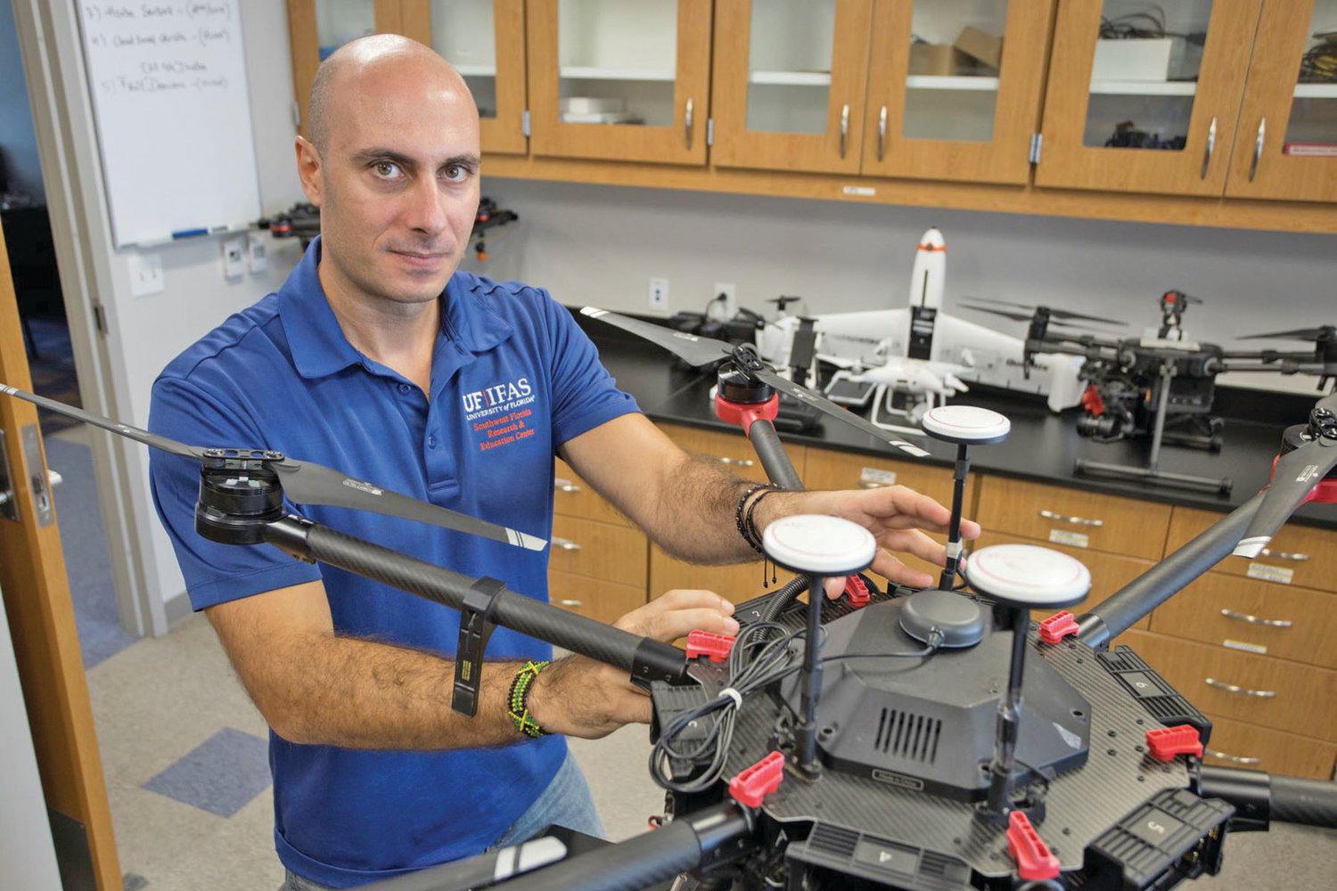 Dr. Yiannis Ampatzidis with a drone in his lab at the Southwest Florida Research and Education Center.